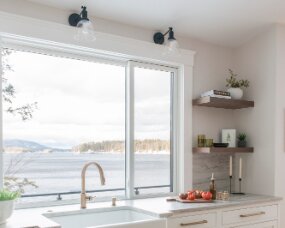 140-05 PERIMETER Wood : Maple; Paint Color : Pure White; Door Style : Newport; Face Frame : Beaded Inset