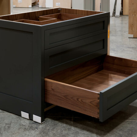 Three Drawer Base Cabinet with Pipe Chase - Bottom Drawer Open